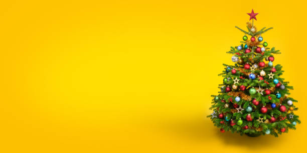 istock Decorated pretty Christmas tree on yellow background 2172344263