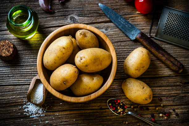 istock Bowl filled with raw fingerling potatoes shot from above on rustic table. 2172345057