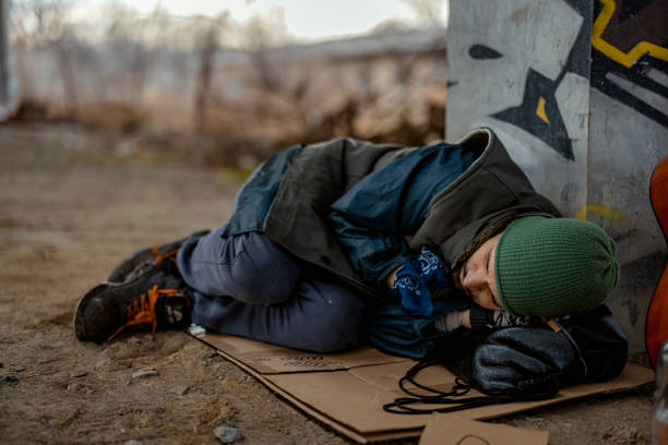 istock Homeless Man Sleeping Under the Bridge 2172345364