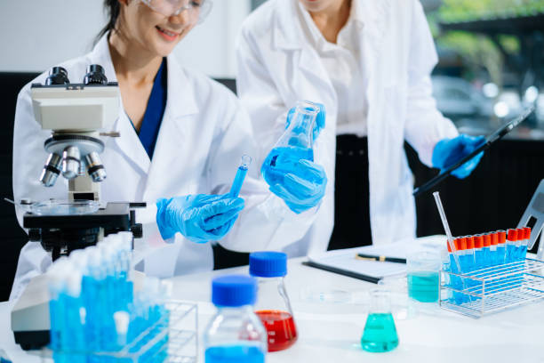 istock Female Scientists Conducting Chemistry Research in Modern Laboratory 2172348596
