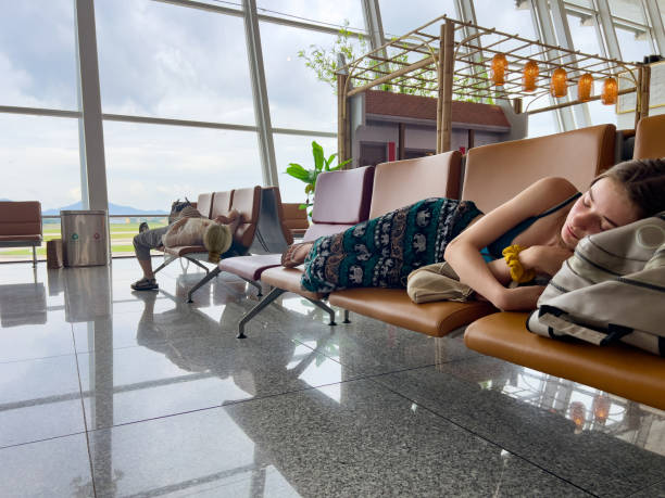 Airport terminal glass window with view of airplane, airport interior departure hall for travel and transportation concept.