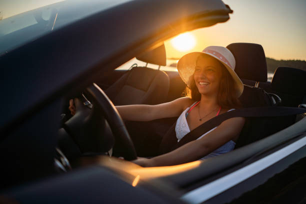 istock Happy girl drives a convertible 2172353695
