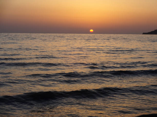 istock Sunset over Calm Sea 2172355637