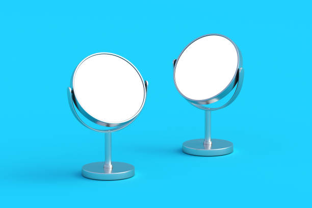 istock Two desktop makeup mirrors with white isolated space on blue background. Cosmetic accessories. 3d render 2172357232