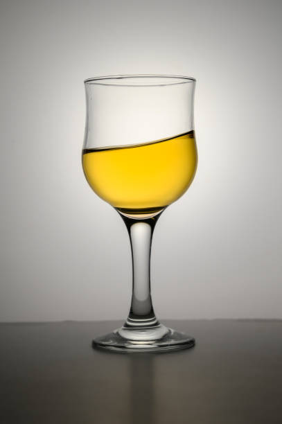 istock White wine swirling into glass 2172360023