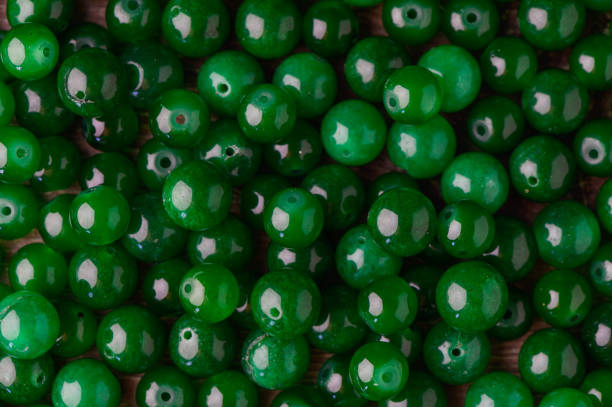 istock green balls of real stone for making amulets as a background 1 2172360048