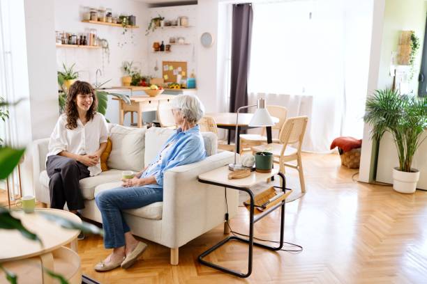 istock An elderly person having a conversation with a young adult 2172361130