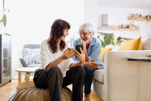 istock Senior woman learning how to use a smartphone from a volunteer 2172361206