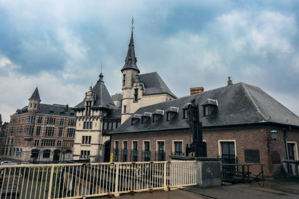 Antwerpen, Belgium - December 3, 2023: The captivating buildings in Antwerpen feature intricate Gothic and Renaissance architecture. Their stately designs stand out against an overcast sky, offering a glimpse into the city's rich history.