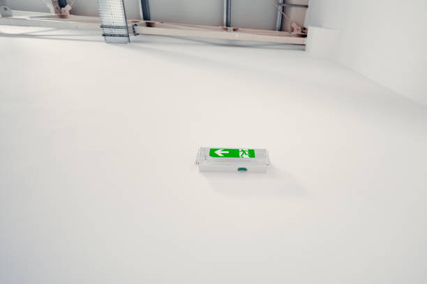 Green emergency exit sign showing the way to escape from a building