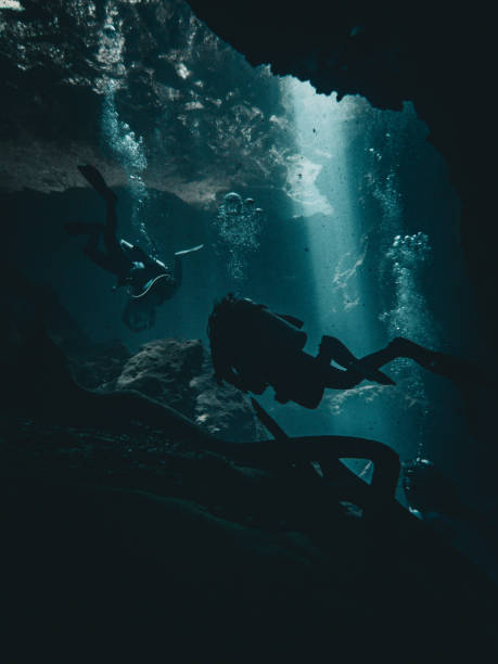 istock Diver enters an underwater cavern, Manatee Springs State Park, Florida 2172364281