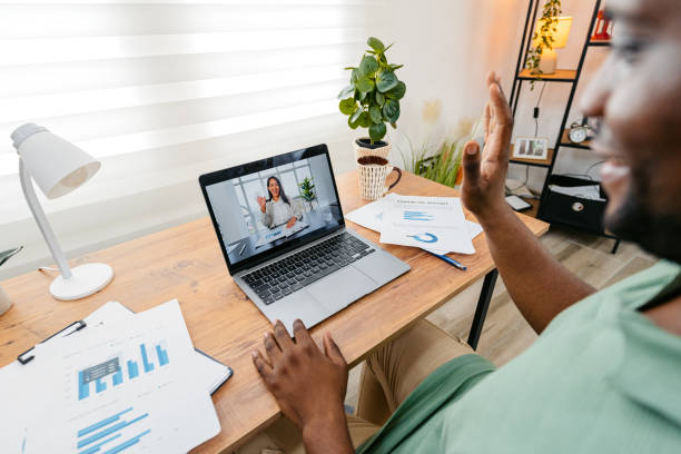istock Young Man Having A Work Video Call On A Laptop In The Home Office 2172364301