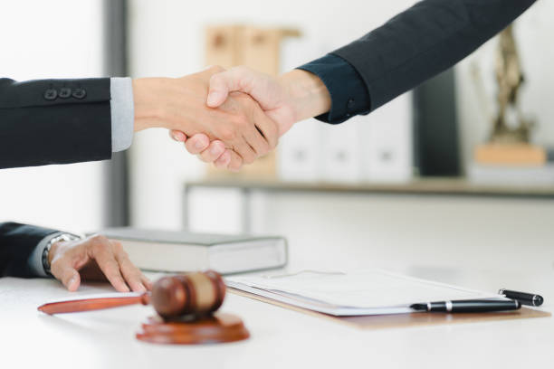 istock A professional handshake symbolizes agreement and collaboration in legal setting. 2172364976