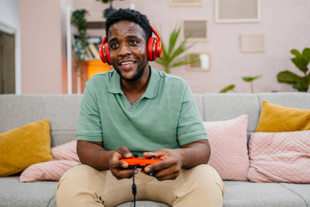 istock Young Man Playing Video Games On A Joystick At Home 2172365097