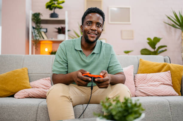 istock Young Man Playing Video Games On A Joystick At Home 2172367626
