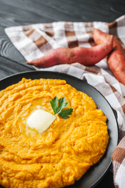 istock delicious mashed sweet potatoes on a black wooden rustic background 2172370723
