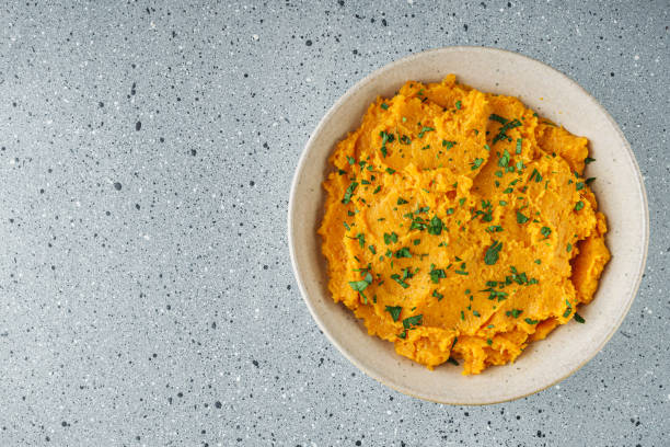 istock delicious mashed sweet potatoes on a light stone background 2172370795