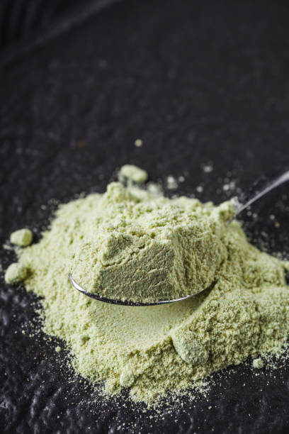 istock fragrant wasabi powder on a black wooden background 2172370953