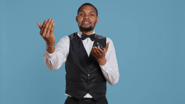 istock Professional bellboy ringing service bell and advertising concierge assistance 2172371171