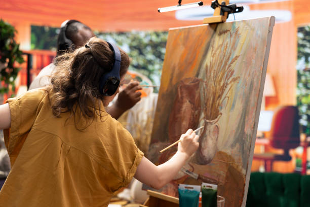 istock Diverse painters apply watercolor paint with brushstrokes for certain technique 2172377947
