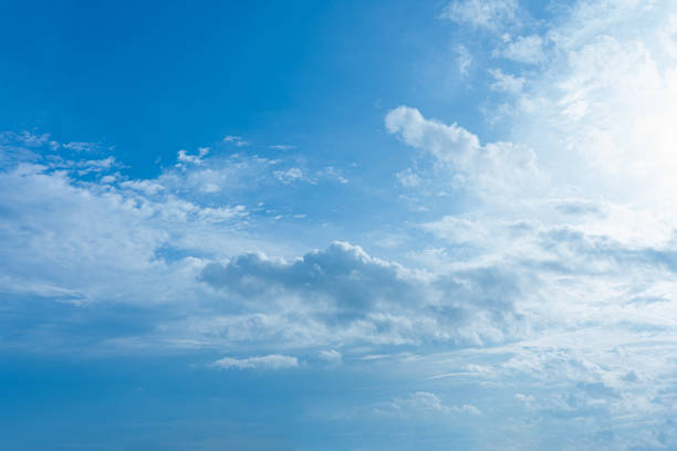 istock Beautiful fluffy white clouds drift across a clear blue sky, creating a breathtaking summer cloudscape 2172378344