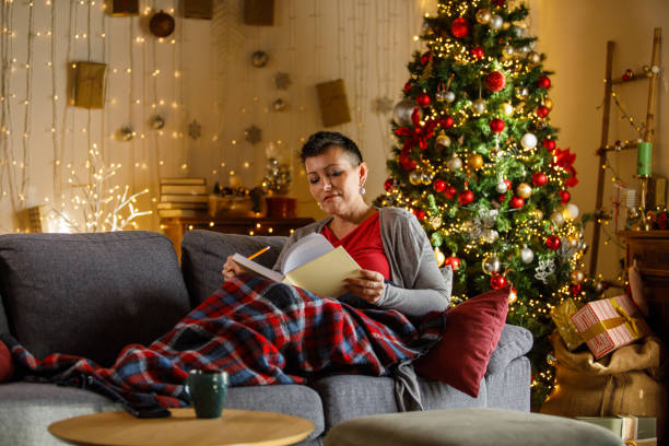istock Woman writing journal while enjoying Christmas holidays 2172385181
