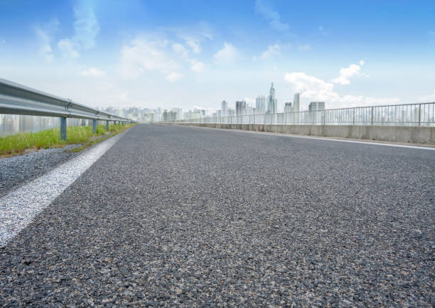 3d rendering smart city with empty road leading to high rise building cityscape