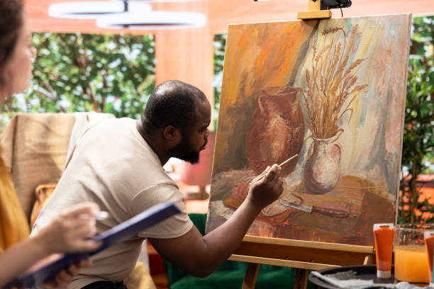 istock Painters team spend quality time on painting in their artistic studio 2172386397