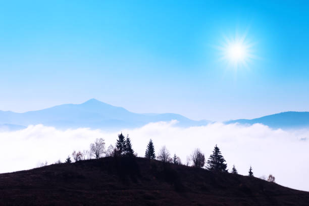 istock Beauty blue mountains range with clear sky and trees silhouette 2172391501