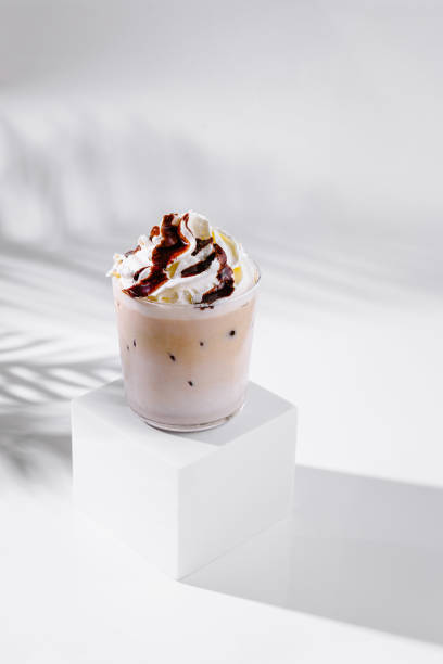 istock Iced coffee with whipped cream and chocolate sauce on white background 2172391955