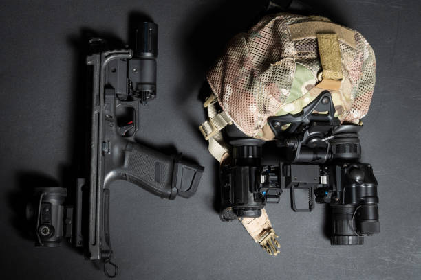 istock Tactical gear and weapons, cap and binocular night vision device, pistol with buttstock, red dot sight and flashlight. 2172392292