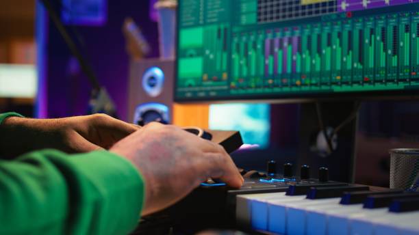 istock Audio engineer producing new music on mixing console in home studio 2172393595