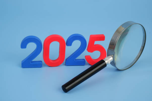 istock Magnifying glass and numbers 2025. 2172394766