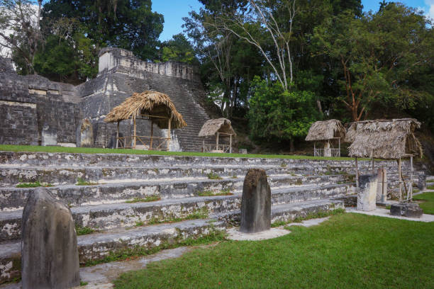 istock Exploring ancient Mayan ruins at Tikal in Guatemala surrounded by lush greenery and historical structures 2172395452