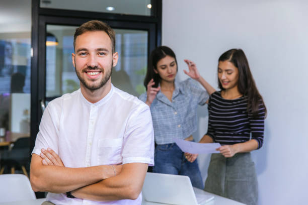 istock Businessmans crew working with new startup project in modern Office. Group of diverse businesspeople working together around a meeting table in an office 2172395511