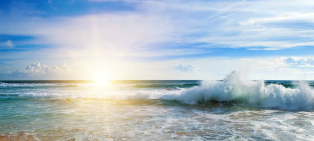 istock Sea and bright sun on blue cloudy sky. 2172399913