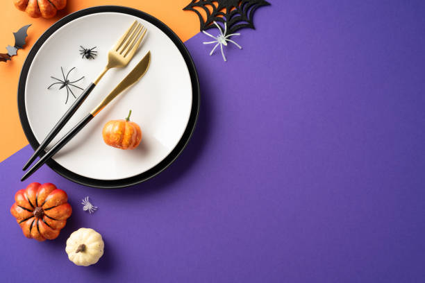 istock Festive Halloween table setting with pumpkins, spiders, and colorful decorations creating a spooky and fun atmosphere 2172401525