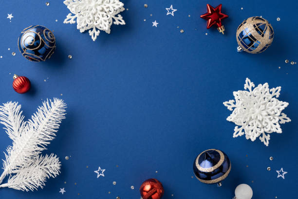 istock Festive Christmas decorations featuring ornaments, snowflakes, and pine branches on a blue background. Perfect for holiday greetings and seasonal designs 2172401598