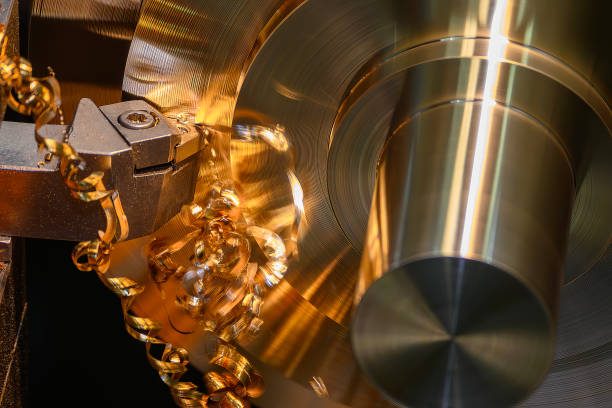 istock The lathe machine finish cut the brass material parts by lathe tools. 2172401796