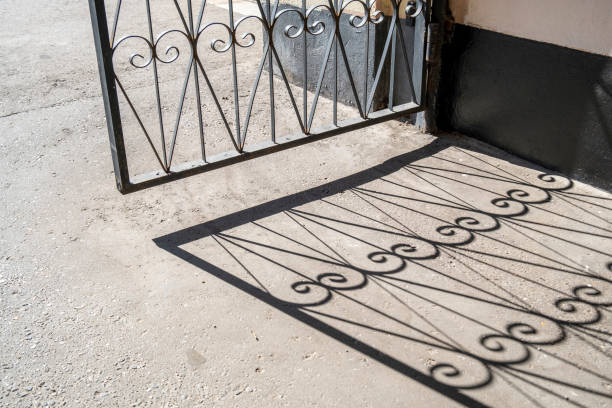Shadow of the wicket on the pavement, abstract background.