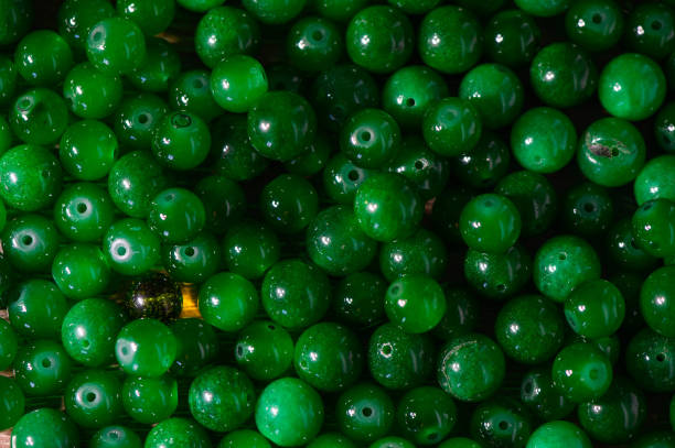 istock green balls of real stone for making amulets as a background 2172405247