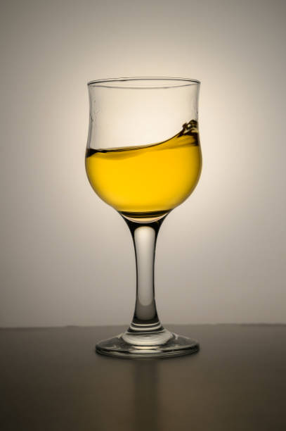istock Fresh apple juice in a glass beaker isolated on a white background 2172405251
