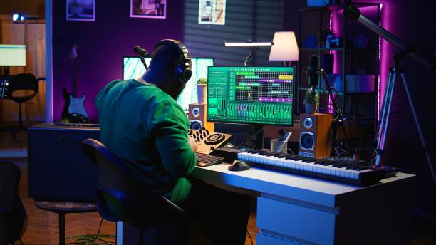 istock Sound engineer mixing and mastering new music on console and daw software 2172405529