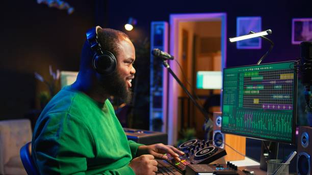 istock Young musician twisting knobs and mixing tunes with a console 2172406873