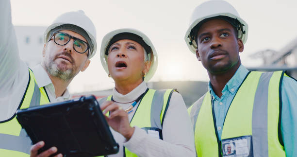 istock Construction, teamwork and people on tablet in city for inspection, building and maintenance. Engineering, architecture and men and women on tech for urban planning, infrastructure and manufacturing 2172407992