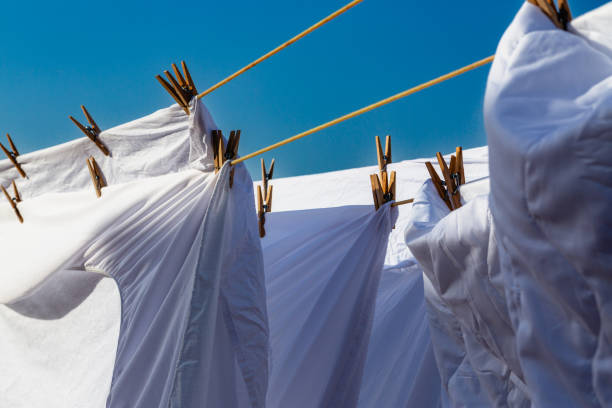 istock Murcia, Spain - 12th August 2024 - White laundry drying in sunlight against a clear blue sky, creating a vibrant atmosphere during a summer day 2172413069