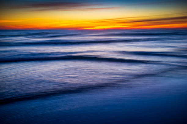 istock Tranquil Ocean Waves Under Vibrant Sunset Sky 2172423775