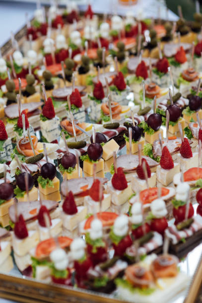 istock A large selection of various snacks for guests on a mirror surface. Buffet before an important event 2172424049