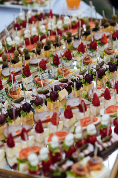 istock A large selection of various snacks for guests on a mirror surface. Buffet before an important event 2172424095