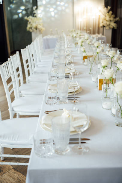istock Elegant neutral coloured wedding table scape with flowers and candles 2172425954